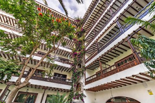 a building with plants on the side of it at Coral Teide Mar in Puerto de la Cruz