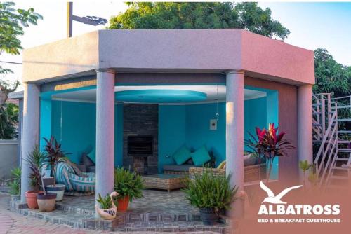 a small building with a large blue at The Albatross in Gaborone