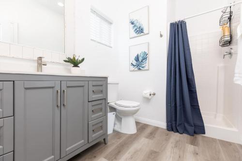 a bathroom with a sink and a toilet and a shower at Comfy and Stylish 4 Bathrooms 26 in Ridgecrest
