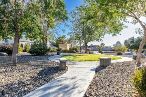a walkway with benches in a park with trees at Luxury, Style and Comfort 4 Bathrooms 21 in Ridgecrest