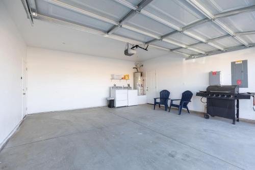 a garage with two chairs and a piano in it at Luxury, Style and Comfort 4 Bathrooms 21 in Ridgecrest