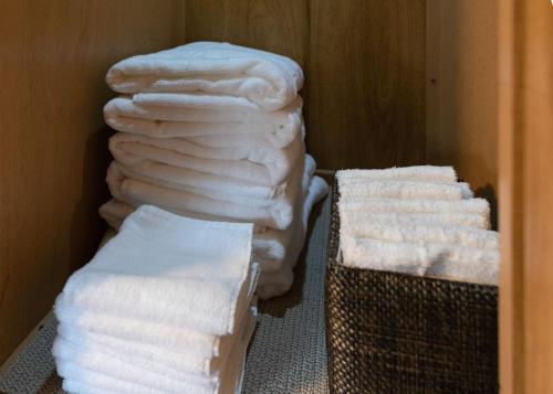 a bunch of towels are stacked in a room at Beach Get Away Fabulous Vintage Trailer in Grayland