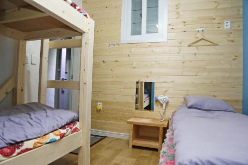 Postel nebo postele na pokoji v ubytování OP 102 Guesthouse