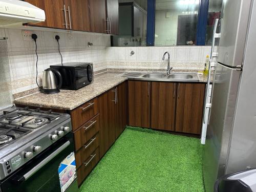 Kuchyň nebo kuchyňský kout v ubytování Abu Dhabi Center - Unique Bed Space