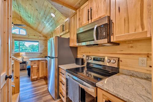 a kitchen with a stove and a refrigerator at Retreat on the Lake in Hiawassee