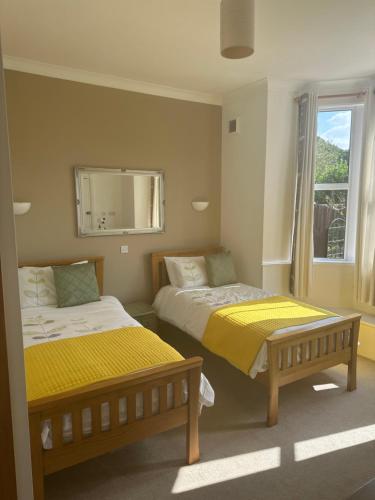 En eller flere senge i et værelse på Station House Holiday Cottages, Exclusively For Grown Ups, Thornton Dale