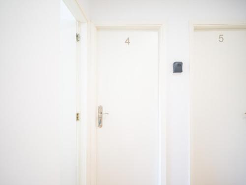 two doors with numbers on them in a room at Texeda Room Suites in Tejeda