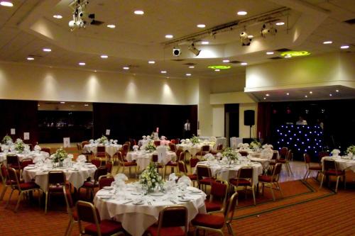 a banquet hall with white tables and chairs at Best Western Ipswich Hotel in Ipswich