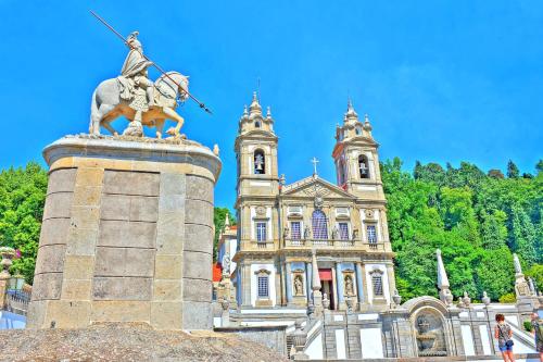 a statue of a man on a horse in front of a building at Holiday Inn Braga by IHG in Braga