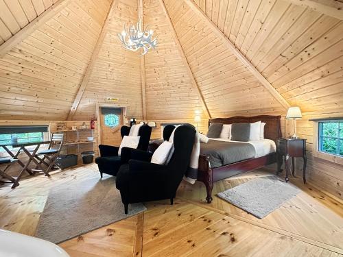Postel nebo postele na pokoji v ubytování Aos Sí Lodges