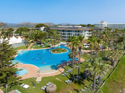 an aerial view of a pool at a resort at Playa Esperanza Resort Affiliated by Meliá in Playa de Muro