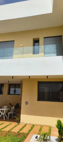 a view of a building with a table and chairs at Villa Elia in Tamaris