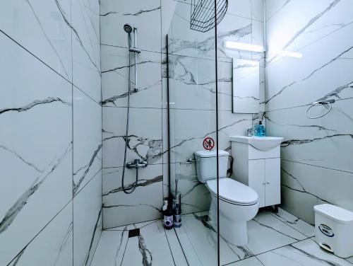 a bathroom with a toilet and a glass shower at Holiday Cyprus 001 in Polis Chrysochous