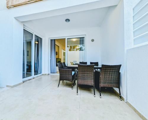 a dining room with a table and chairs at Holiday Cyprus 001 in Polis Chrysochous