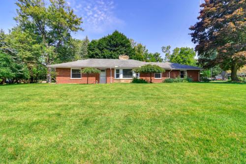 a house with a large yard in front of it at Home about 17 Mi to Detroit with Patio and Grill! in Southfield
