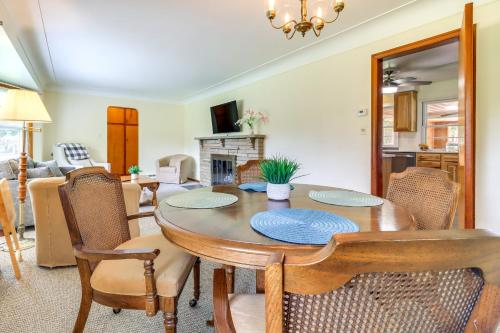 a dining room with a table and chairs at Home about 17 Mi to Detroit with Patio and Grill! in Southfield