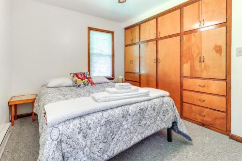 a bedroom with a bed and a dresser at Home about 17 Mi to Detroit with Patio and Grill! in Southfield