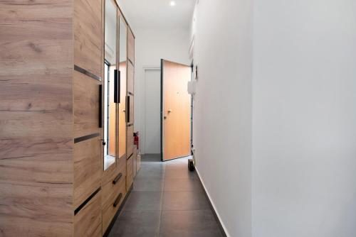 a hallway with wood paneled walls and a long hallway at Casa Alba La Casa Delle Coccole in Savona