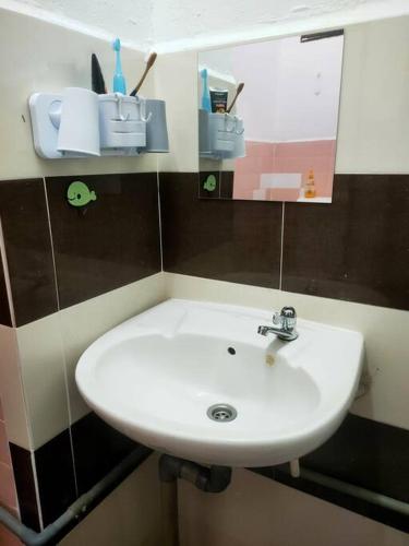 Ванная комната в Taman Tinah Homestay
