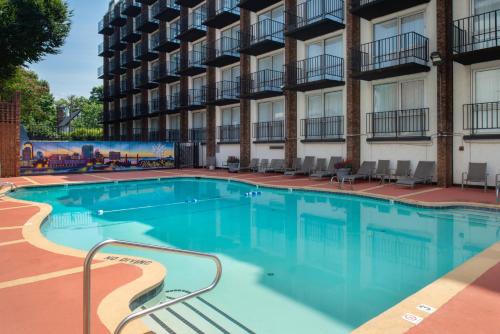 a large swimming pool in front of a building at Hawthorne Inn & Conference Center in Winston-Salem