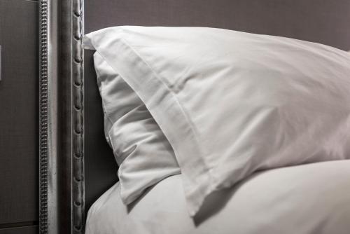 Ένα ή περισσότερα κρεβάτια σε δωμάτιο στο Hotel Doriguzzi