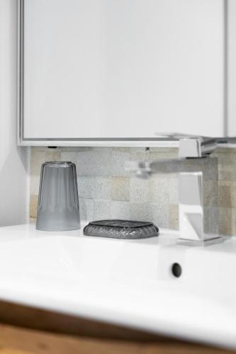 a kitchen counter top with a stove top oven at Apparts de l'Oncle Louis in Versailles