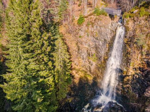 an aerial view of a waterfall on the side of a mountain at Holiday Home Springbank Lodge by Interhome in Drumnadrochit