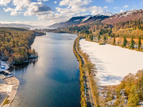 an aerial view of a river in the mountains at Holiday Home Springbank Lodge by Interhome in Drumnadrochit