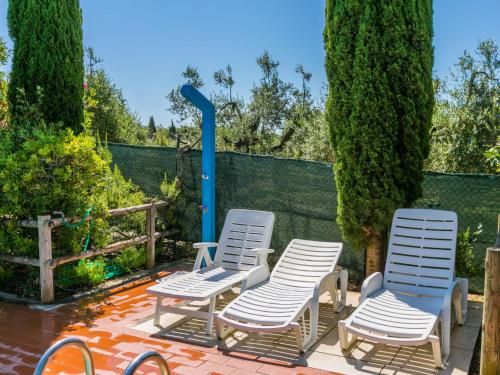 a group of chairs sitting on a patio at Holiday Home Oliveta 1 by Interhome in Fiorino