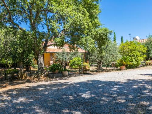 a house with a fence and trees in a yard at Holiday Home Oliveta 1 by Interhome in Fiorino