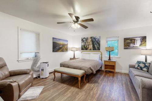 a bedroom with a bed and a couch at Moat Mountain Retreat in Conway