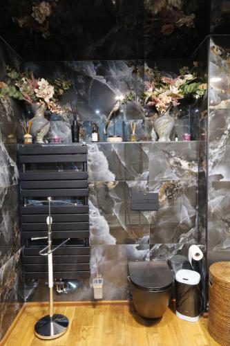 a bathroom with a sink and a bath tub at Cozy Constellations in Poiana Brasov