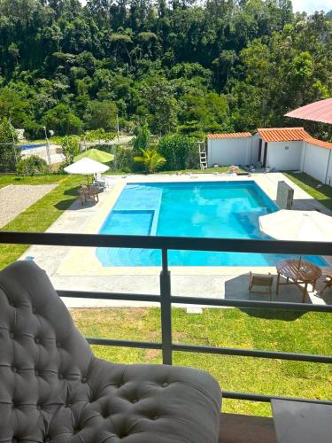 a view of a swimming pool from a house at Villa San Ramon - BIG HOUSE - Chamchamayo in San Ramón