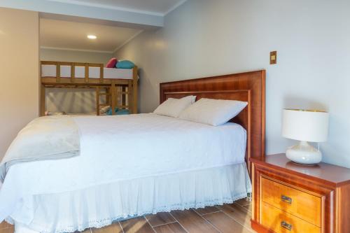 a bedroom with a bed and a bunk bed at Villa San Ramon - BIG HOUSE - Chamchamayo in San Ramón