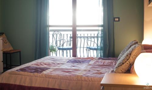 Een bed of bedden in een kamer bij Bed & Breakfast Cas'Alda