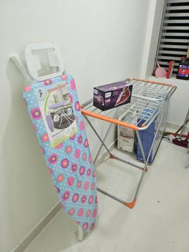 a snowboard on a rack next to a table at Best Appartment in Al Khuwair in Bawshar