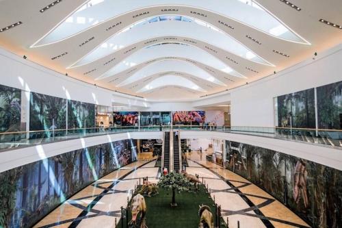 a large building with paintings on the walls at Best Appartment in Al Khuwair in Bawshar