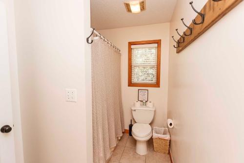 a bathroom with a toilet and a shower at Oceanside, Remote Quiet Area, Secluded, Screened Porch, 4x2018, Wash Woods in Knotts Island