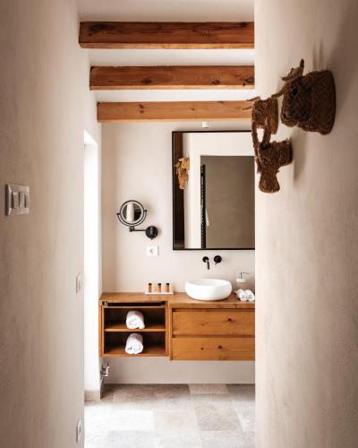a bathroom with a sink and a mirror at Ca Jardi, Luxury Ibiza-Style villa with private pool, Javea in Jávea