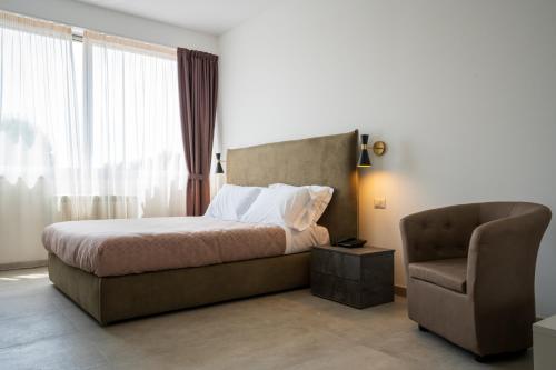Postel nebo postele na pokoji v ubytování Hotel Bulà
