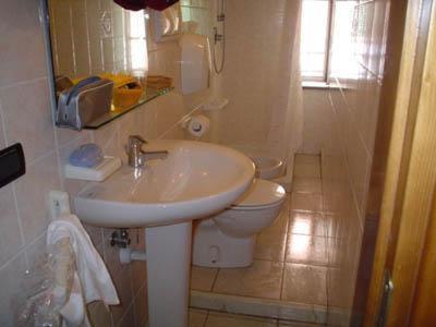 a bathroom with a sink and a toilet at Locanda Ca Dei Duxi in Riomaggiore