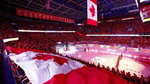 a crowd of people watching a hockey game in a stadium at Staybridge Suites - Calgary Airport by IHG in Calgary