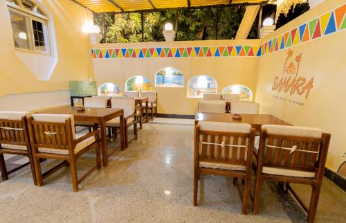a dining room with tables and chairs in a restaurant at Samara Guest House in Aswan