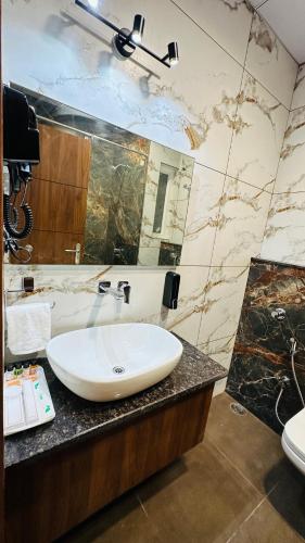 a bathroom with a sink and a mirror at Atalchhatra Luxury Boutique Hotel in Jaipur