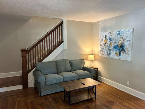 a living room with a couch and a table at Palmetto 2 Bed Family House in Cincy near Hyde Park in Cincinnati