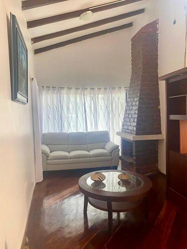 a living room with a couch and a coffee table at Entire Holiday Home in Shell