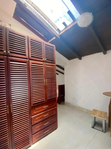 a room with wooden cabinets and a skylight at Entire Holiday Home in Shell