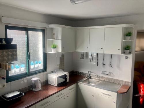Dapur atau dapur kecil di Casa do Sol