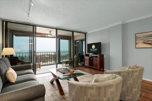 TV a/nebo společenská místnost v ubytování The Islander - 2D by Sea Scape Properties