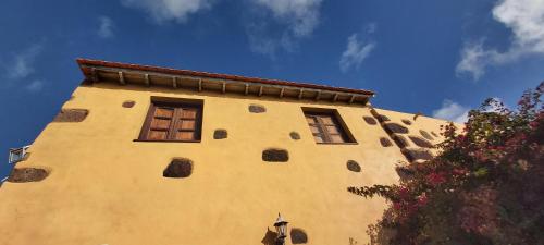 a yellow building with windows on top of it at VV Las Vistas de El Pinar in El Pinar del Hierro